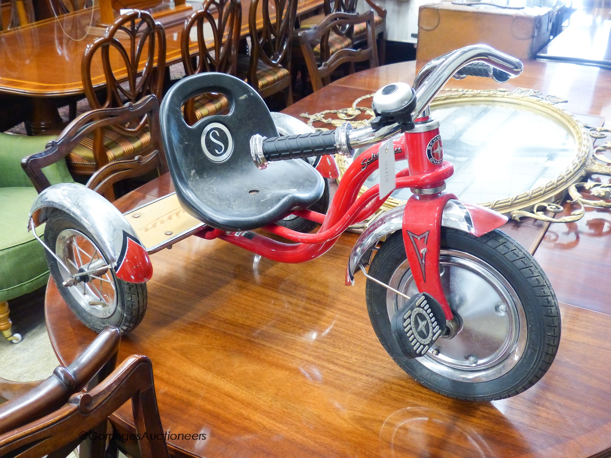 A child's Schwim tricycle.